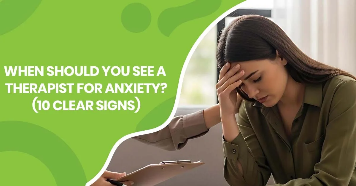 A person sitting thoughtfully in a therapy office, representing when to see a therapist for anxiety | Pearlman & Associates